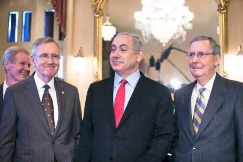 Benjamin Netanyahu, the Israeli prime minister, meets members of the US Senate Leadership in Washington yesterday. His talks with the US President Barack Obama focused on Iran's nuclear programme, rather than Israeli-Palestinian peace. With Mr Obama eager to secure support from the pro-Israel bloc ahead of the elections, Palestinians have criticised his foreign policy.