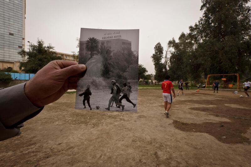 This Tuesday, March 12, 2013 photo shows a general view of Abu Nawas park in Baghdad, at the site of a photograph taken by Maya Alleruzzo showing Iraqi orphans playing soccer with a U.S. soldier from the Third Infantry Division in April, 2003. The park that runs along Abu Nawas Street, named after an Arabic poet, is now a popular destination for families who are drawn by the manicured gardens, playgrounds and restaurants famous for a fish called mazgouf. Ten years ago, the park was home to a tribe of children orphaned by the war and was rife with crime. (AP Photo/Maya Alleruzzo) *** Local Caption ***  Mideast Iraq On This Site.JPEG-07fce.jpg