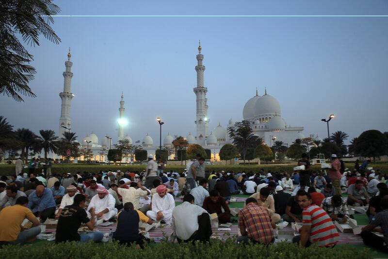 ABU DHABI - UNITED ARAB EMIRATES - 10JULY2013 - Labourers having Iftar meal on the first day of the Holy month Ramadan at Grand mosque yesterday in Abu Dhabi. Ravindranath K / The National