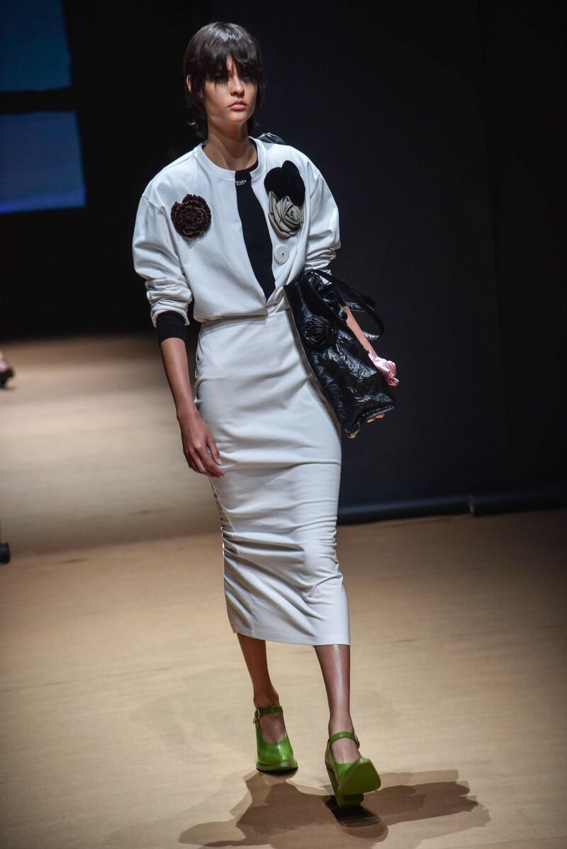 A long streamlined skirt with a bomber jacket at the Prada show. EPA 