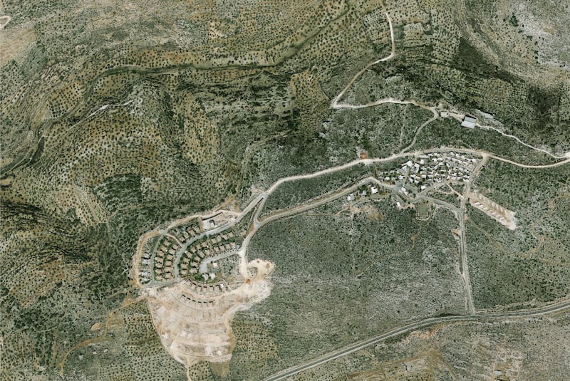 A handout photo made available by the Peace Now organization showing an aerial view of the Israeli settlement of Bruchin in the West Bank.  EPA