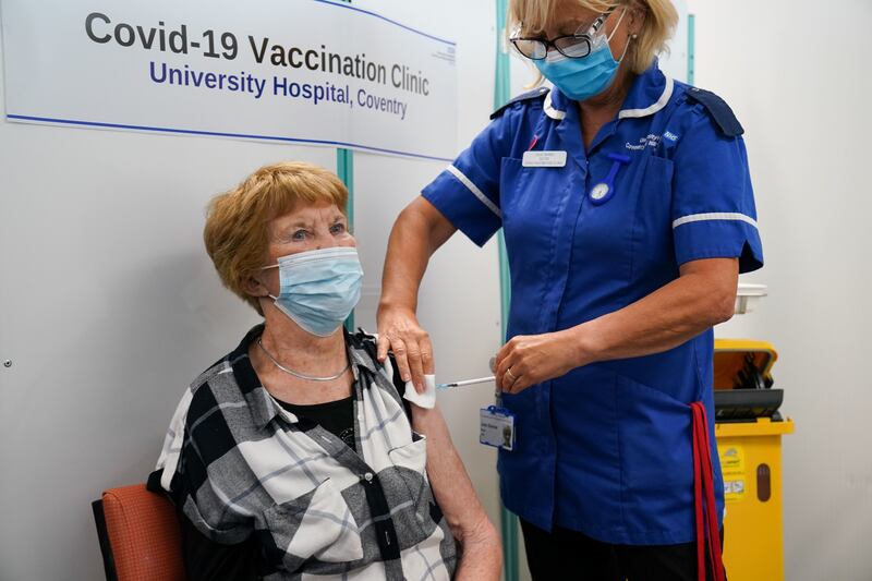 Margaret Keenan, the first person to receive the coronavirus vaccine, is given her booster jab at University Hospital Coventry in the UK. PA