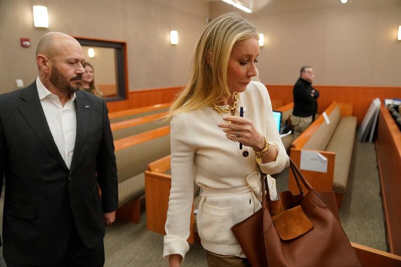 Paltrow wore a cream belted cardigan from G.Label by Goop, her own brand, with a vintage Celine tote bag and Foundrae gold jewellery for day two of the trial on March 22. AP Photo