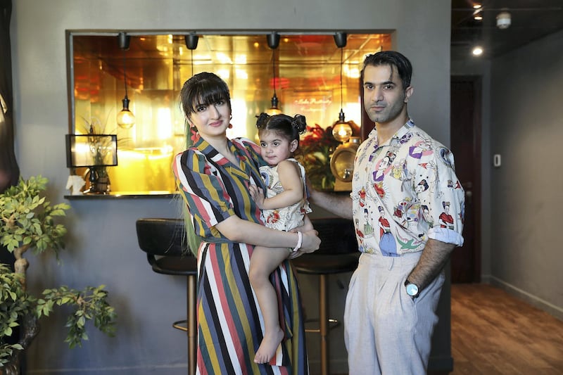DUBAI , UNITED ARAB EMIRATES , December 15  ��� 2018 :- Areeb Hassan with his wife Fatima Areeb and daughter Aairah Areeb at their apartment in International City in Dubai. ( Pawan Singh / The National ) For Luxury and Lifestyle. Story by Melanie Hunt