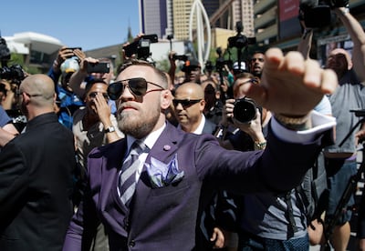 Conor McGregor waves to fans during the arrivals for a boxing match Tuesday, Aug. 22, 2017, in Las Vegas. McGregor is scheduled to fight Floyd Mayweather Jr. in a boxing match Saturday in Las Vegas. (AP Photo/John Locher)