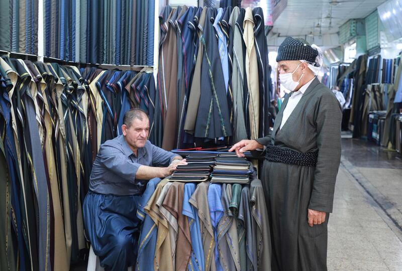 A man shops for fabric in the northeastern city of Sulaimaniyah, Iraq.  AFP