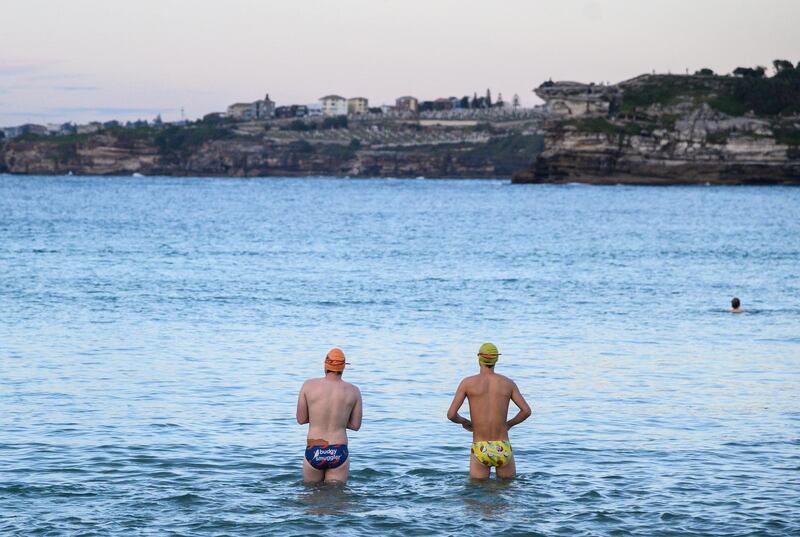 People swim as the sun rises at Bondi Beach in Sydney, Australia.  EPA