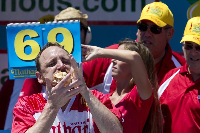 Joey Chestnut competes in Nathan’s Famous Fourth of July International Hot Dog Eating Contest men’s competition. Chestnut came in first eating 70 hot dogs and buns in 10 minutes. Matt Stonie came in second eating 53 hot dogs and buns in 10 minutes. Mary Altaffer / AP Photo
