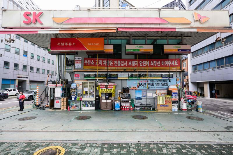A petrol station with fuel dispensers hanging down from the ceiling in Seoul, South Korea.