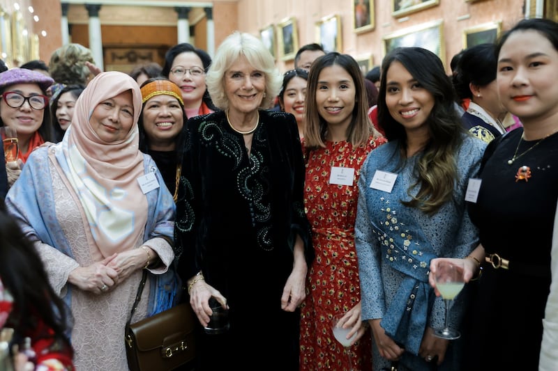 Queen Consort Camilla with women from Britain's East and South-East Asian communities at Buckingham Palace. PA