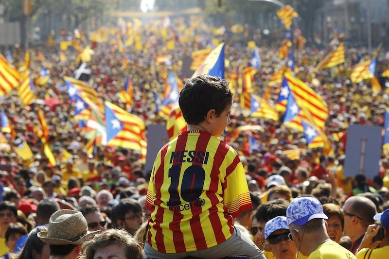 A young Barcelona fan wearing Lionel Messi's shirt shown last year at celebrates for Catalonia National Day at the Gran Via de les Corts Catalanes in Barcelona. Quique Garcia / AFP / September 11, 2014