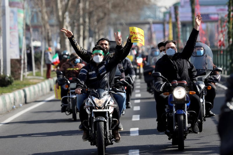 Iranians ride on motorcycles as they participate in the celebration of the 42nd anniversary of the Islamic Revolution in Tehran. WANA (West Asia News Agency) via REUTERS