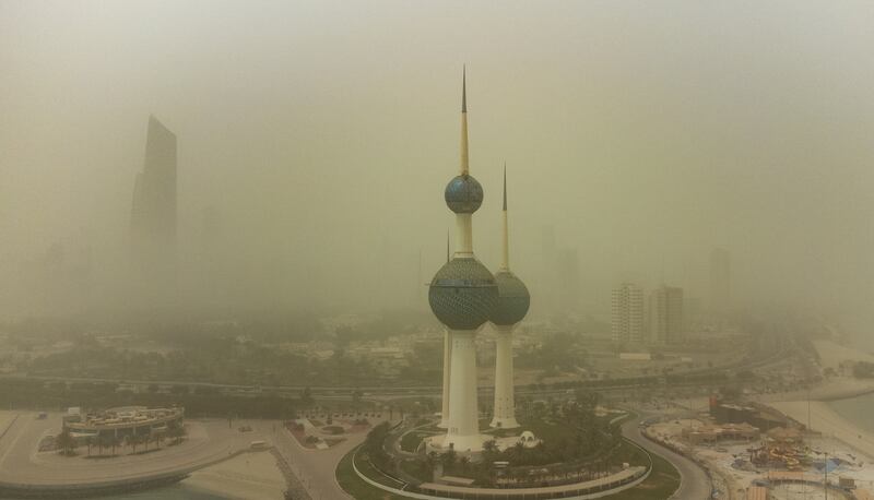 Buildings are shrouded in heavy dust in Kuwait City, Kuwait. The Kuwaiti Ministry of Interior on Sunday cautioned against a prevailing unsteady weather marked with a wave of dust that lowered visibility.   EPA