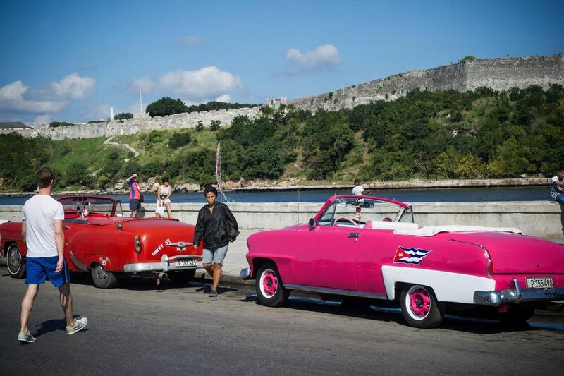 Old American cars in a street of Havana. Fidel Castro imposed a law after assuming power in 1959 that prevented anyone without government permission from importing foreign automobiles. Yamil Lage / AFP