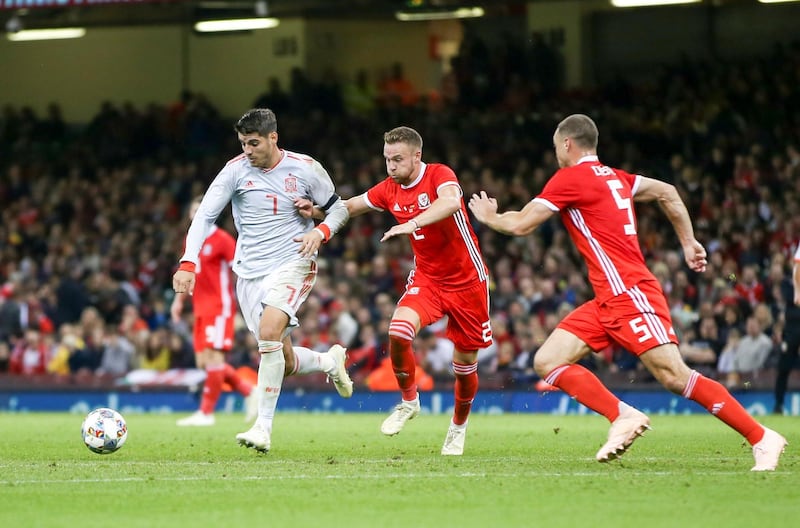 Chris Gunter (C) of Wales and Alvaro Morata (L) of Spain in action  during the international friendly soccer match between Wales and Spain, Cardiff, Wales, Britain. EPA