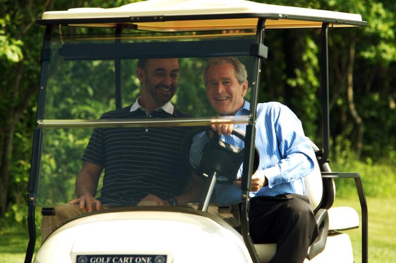 US president George W Bush drives Sheikh Mohammed bin Zayed in a golf buggy at the Camp David retreat in Maryland. Jamie Rose for The National / June 26, 2008