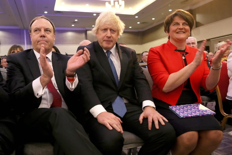 (FILES) In this file photo taken on November 24, 2018, (L-R) Deputy Leader of the DUP (Democratic Unionist Party), Nigel Dodds, former British Foreign Secretary Boris Johnson and leader of the DUP Arlene Foster attend the Democratic Unionist Party (DUP), Annual Conference in Belfast. The fate of Boris Johnson's draft Brexit agreement now rests squarely with Arlene Foster -- a Northern Irish ultra-conservative whose father was shot in the head by the IRA. / AFP / Paul FAITH
