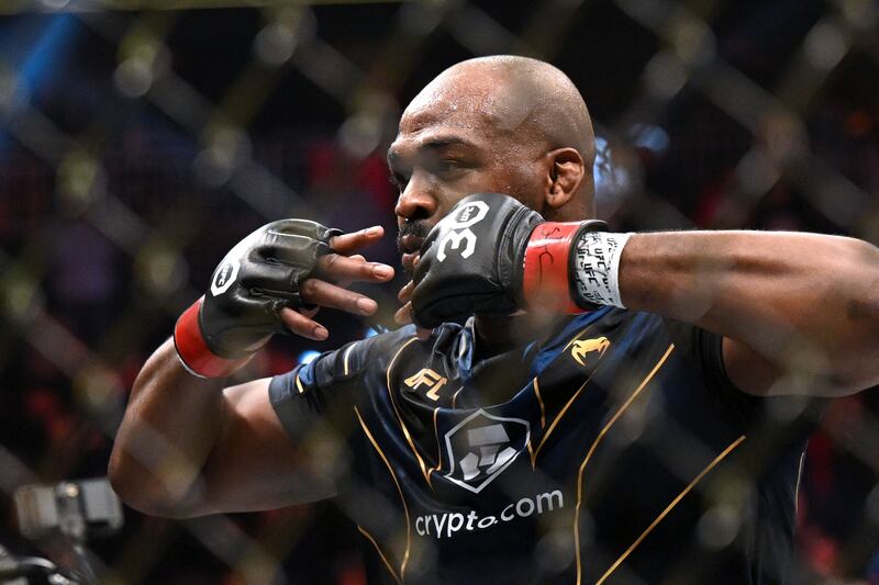 Jon Jones celebrates after defeating Ciryl Gane in their UFC 285 heavyweight title bout. AFP