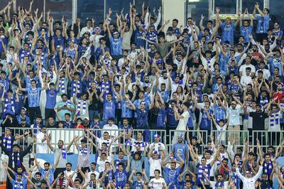 Al Hilal fans cheer for their team during the Saudi Pro League football match between Al Ittihad and Al Hilal at Prince Abdullah Al Faisal Stadium in Jeddah on September 1, 2023. AFP