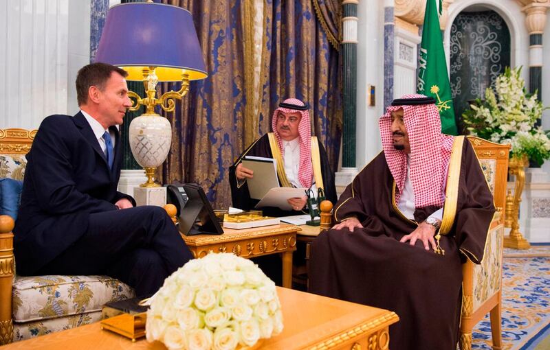 Saudi King Salman bin Abdulaziz talks to the UK's foreign secretary Jeremy Hunt, in Riyadh. AP