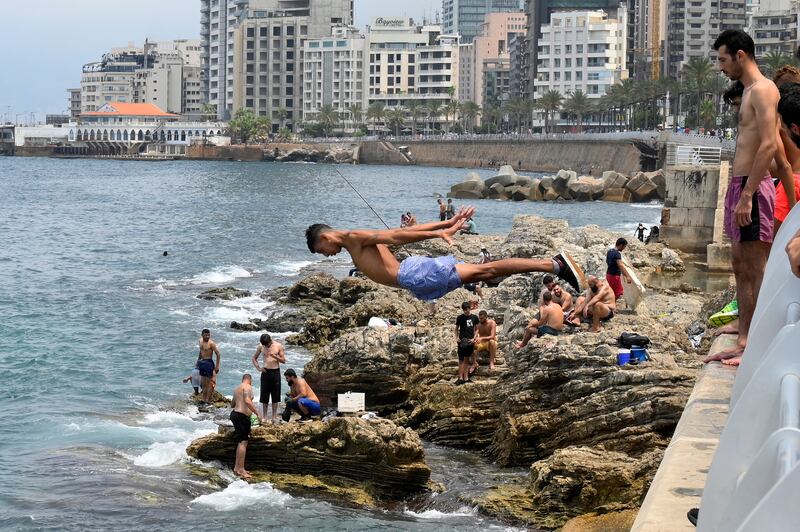 Youths at the Al Manara Corniche on a sunny day in Beirut, Lebanon.