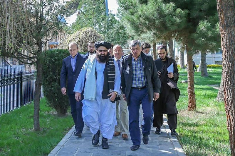 Taliban foreign minister Amir Khan Muttaqi, second left, and Russia's special envoy to Afghanistan, Zamir Kabulov, second right, during a meeting in Kabul. AFP