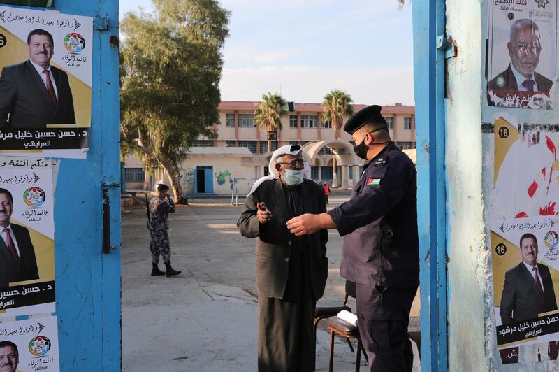 A man enters a polling station as Jordanians began voting in a parliamentary election. AP