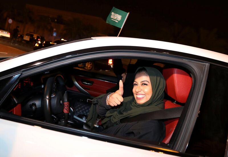 A Saudi woman celebrates as she drives her car in her neighbourhood, in Al Khobar, Saudi Arabia. Hamad I Mohammed / Reuters