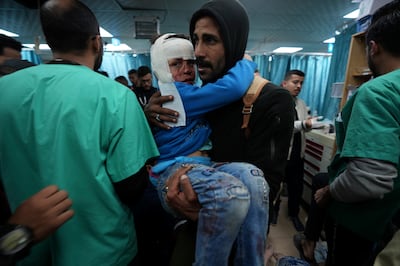 Palestinians wounded in the Israeli bombardment of the Gaza Strip are brought to Al Aqsa hospital in Deir al Balah. AP