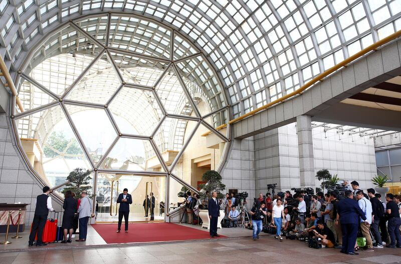 Media gather outside the Ritz-Carlton hotel as part of coverage of the summit between North Korea and the US in Singapore. Edgar Su / Reuters