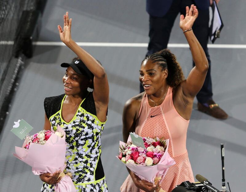 Venus Williams, left, celebrates her success against sister Serena, right, at the Mubadala World Tennis Championship. AP Photo