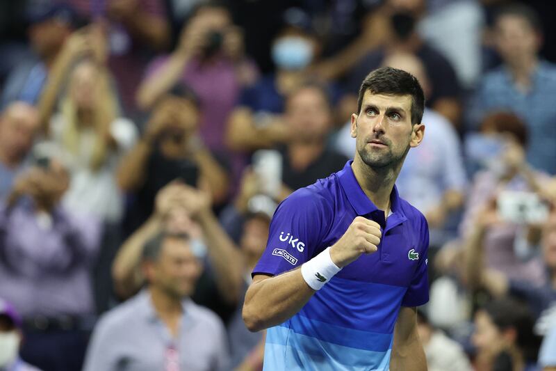 NEW YORK, NEW YORK - SEPTEMBER 08: Novak Djokovic of Serbia celebrates defeating Matteo Berrettini of Italy during their Men's Singles quarterfinal match on Day Ten of the 2021 US Open at the USTA Billie Jean King National Tennis Center on September 08, 2021 in the Flushing neighborhood of the Queens borough of New York City.    Elsa / Getty Images / AFP
