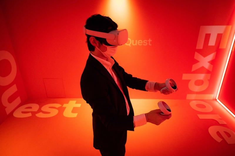 The metaverse is envisaged as a new online world where people wear virtual reality headsets to work, play and socialise. Yuichi Yamazaki / AFP