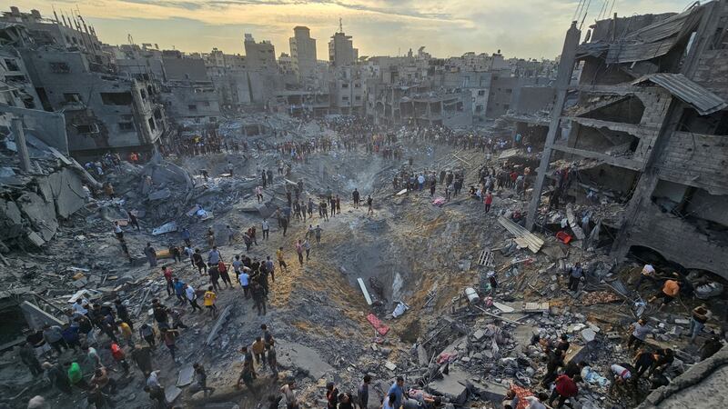 Palestinians search for casualties in Jabalia refugee camp, in the northern Gaza Strip, on Tuesday. Reuters
