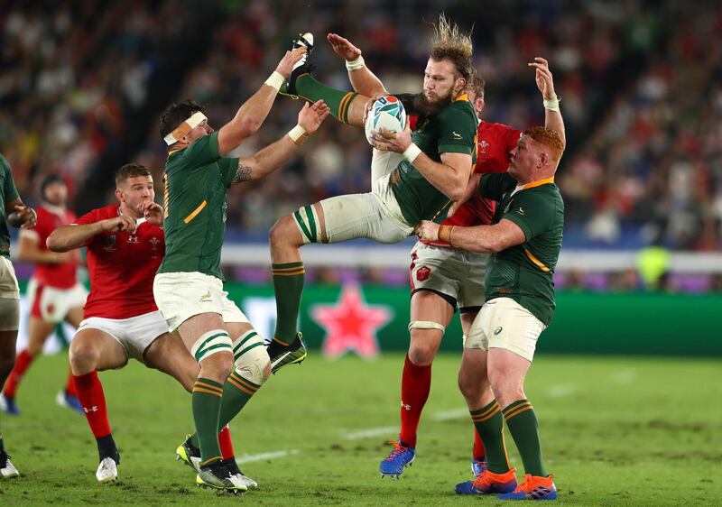 Steven Kitshoff of South Africa helps teammate RG Snyman win a high ball under pressure from Alun Wyn Jones of Wales during the Rugby World Cup 2019 Semi-Final match between Wales and South Africa at International Stadium Yokohama  Yokohama, Kanagawa, Japan. GETTY IMAGES