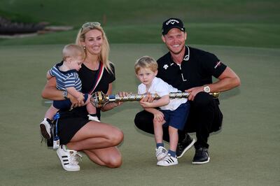 DUBAI, UNITED ARAB EMIRATES - NOVEMBER 18:  Danny Willett of England poses with the DP World Tour trophy wife Nicole Willett and his two children following the final round of the DP World Tour Championship at Jumeirah Golf Estates on November 18, 2018 in Dubai, United Arab Emirates.  (Photo by Ross Kinnaird/Getty Images)