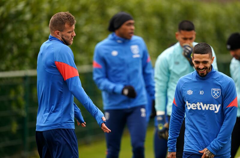 Andriy Yarmolenko, left, and Manuel Lanzini during a training session at Rush Green. PA