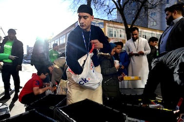 Volunteers at the East London Mosque, in conjunction with Muslim Aid, pack food to feed homeless in London. REUTERS