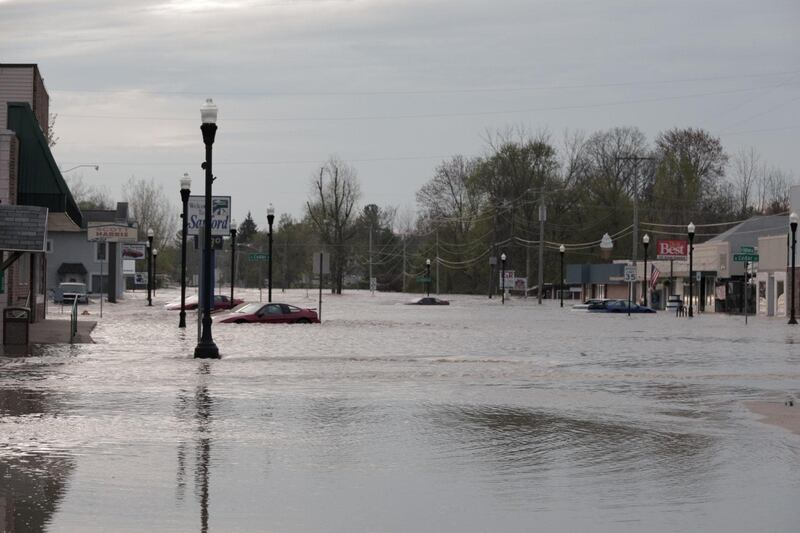 Floodwaters along a street in downtown Sanford, Michigan. TC VORTEX via REUTERS