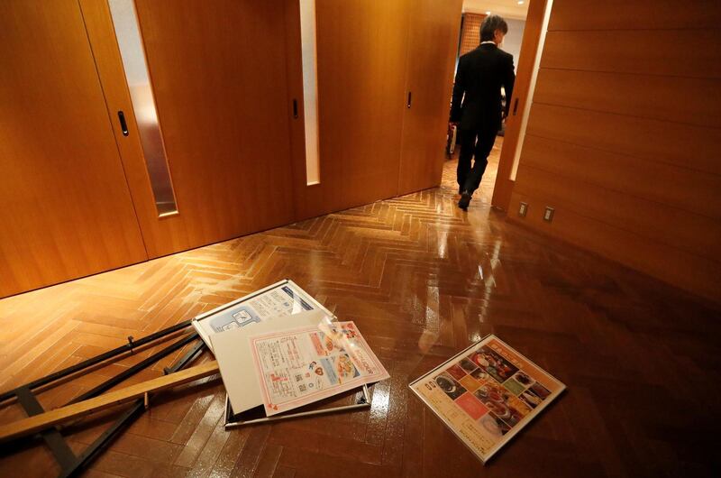 Posters lie on the floor after they fell from the walls of a hotel following a strong earthquake in Iwaki, Fukushima prefecture, Japan February 13, 2021. REUTERS