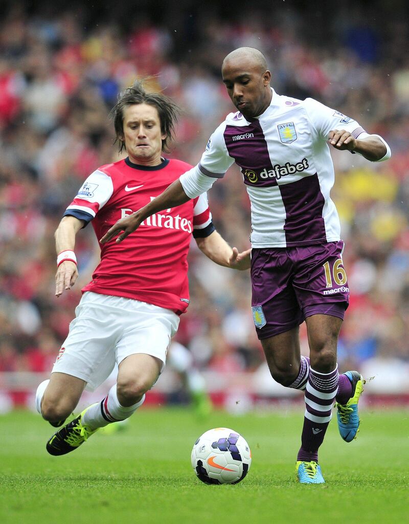 Aston Villa's English midfielder Fabian Delph (R) vies with Arsenal's Czech midfielder Tomas Rosicky (L) during the English Premier League football match between Arsenal and Aston Villa at the Emirates stadium in North London on August 17, 2013. AFP PHOTO/GLYN KIRK 

== RESTRICTED TO EDITORIAL USE. NO USE WITH UNAUTHORIZED AUDIO, VIDEO, DATA, FIXTURE LISTS, CLUB/LEAGUE LOGOS OR “LIVE” SERVICES. ONLINE IN-MATCH USE LIMITED TO 45 IMAGES, NO VIDEO EMULATION. NO USE IN BETTING, GAMES OR SINGLE CLUB/LEAGUE/PLAYER PUBLICATIONS.
 *** Local Caption ***  756456-01-08.jpg