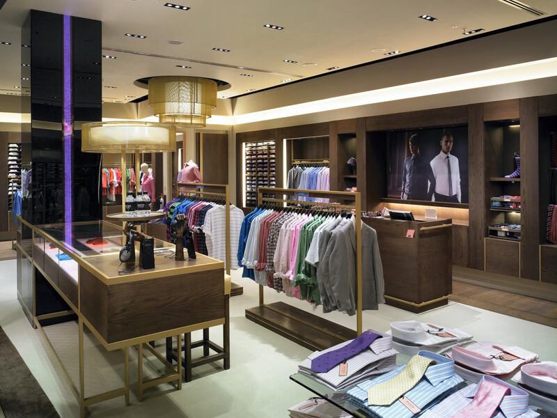 Thomas Pink, Hayes, United Kingdom, Architect Four Iv Design, Thomas Pink View From The Front Right-Hand Corner Of The Store Towards The Till Point With Display Unit In The Foreground And Business Bar On The Left-Hand Side With Led Display Ipods. (Photo by View Pictures/Universal Images Group via Getty Images)