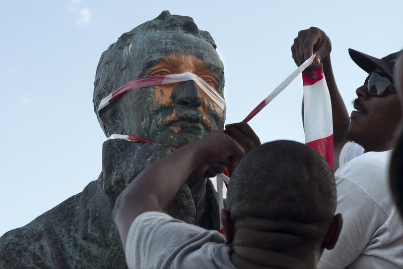Students defaced a statue of Cecil Rhodes at the University of Cape Town. Rodger Bosch / AFP