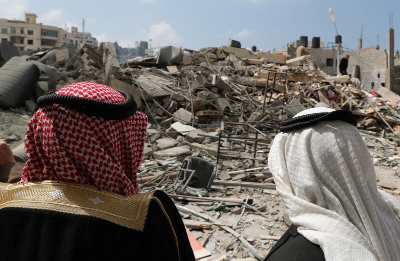 Palestinians look at a destroyed Hamas site in Gaza City. Reuters
