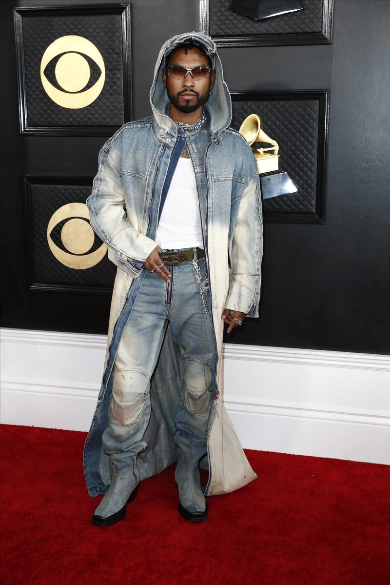 Miguel wears a hooded distressed denim overcoat. EPA 