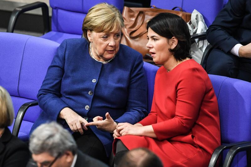 German Chancellor Angela Merkel talks with Annalena Baerbock during a session of the German parliament in Berlin, in January 2020. EPA
