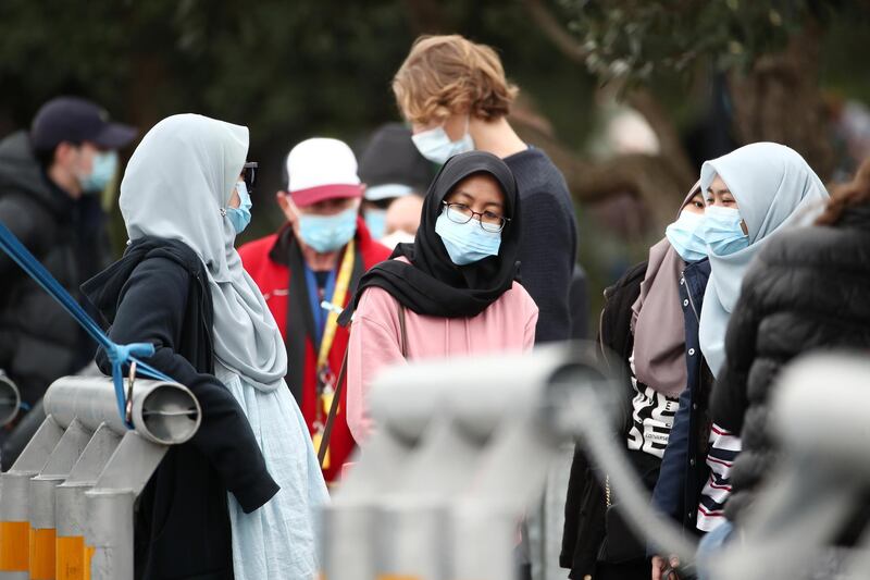 People wait for a walk-up Covid-19 test at Eden Park in Auckland, New Zealand. COVID-19 restrictions have been reintroduced across New Zealand after new COVID-19 cases were diagnosed in Auckland.  Getty Images