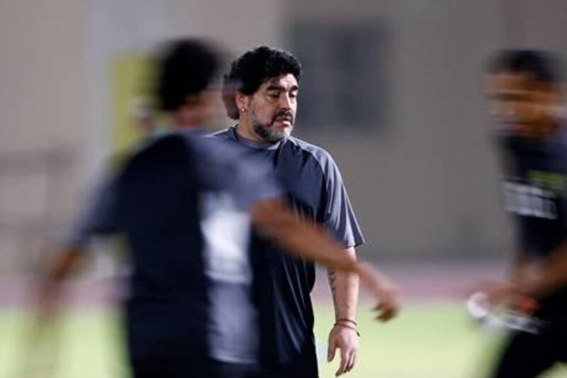 Dubai, United Arab Emirates, Aug. 6 2011, Al Wasl FC Training- Al Wasl Head Coach Diego Maradona watches his coaches and players on the pitch at the Al Wasl FC training facility. Maradona watches his players as they go through ball control drills. Mike Young / The National?