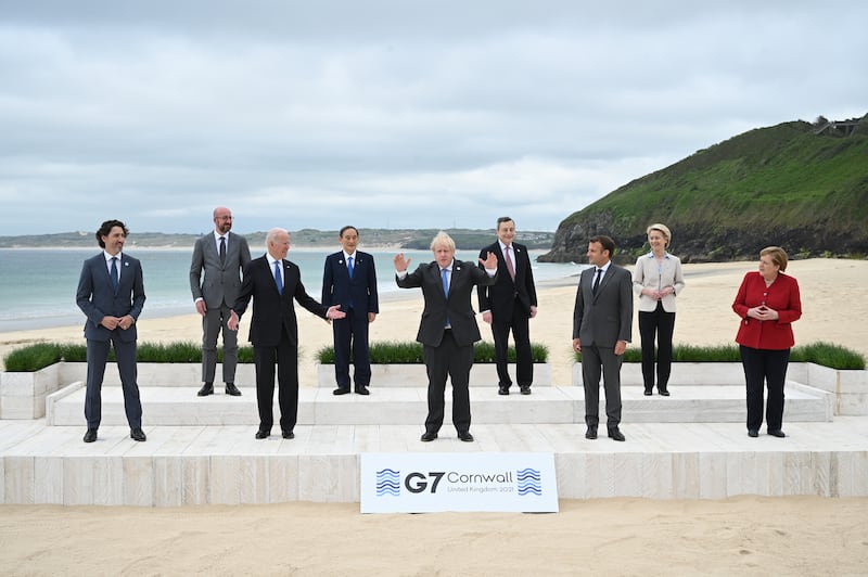Left to right, Canadian Prime Minister Justin Trudeau, President of the European Council Charles Michel, Mr Biden, Japanese Prime Minister Yoshihide Suga, Mr Johnson, Italian Prime Minister Mario Draghi, French President Emmanuel Macron, President of the European Commission Ursula von der Leyen and Ms Merkel pose during the G7 Summit In Carbis Bay. Getty Images