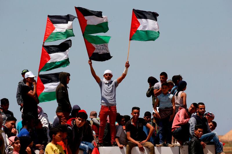 Palestinian demonstrators gather east of Khan Yunis in the southern Gaza Strip during a protest marking 71th anniversary of 'Nakba'. AFP